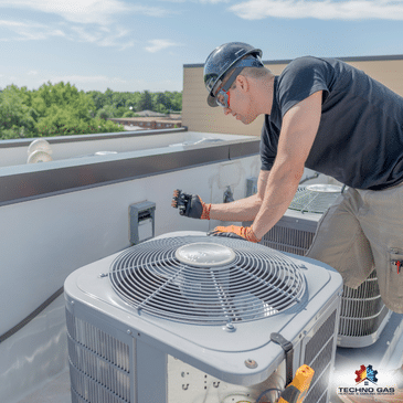 Techno Gas Technician Inspecting Air Conditioner in North Vancouver